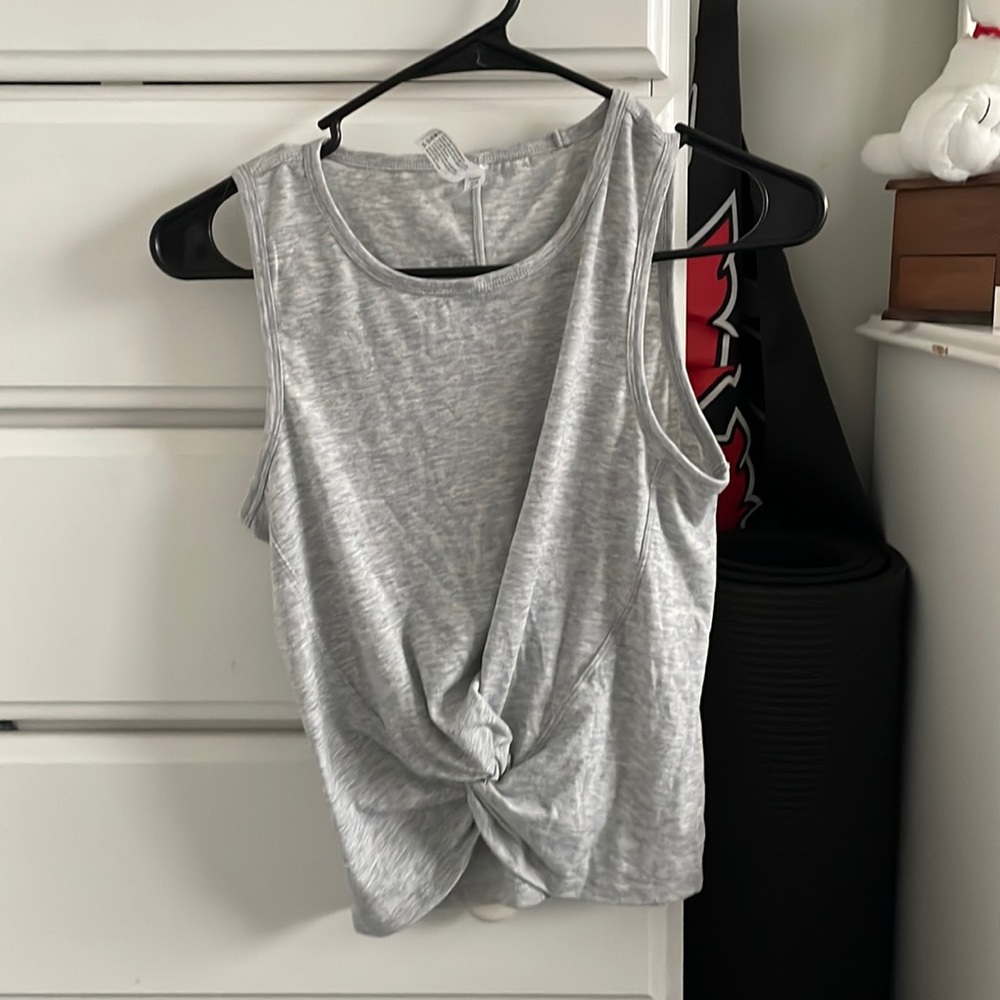 Grey tank top with a twist at bottom